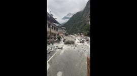 Excavators clear mountain flood debris in China