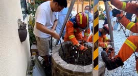 Heroic firefighter lowered into deep well to rescue boy trapped after falling in China