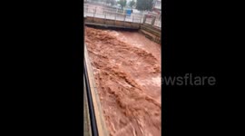 Heavy rainfall turns river into dangerous rapids as storm hits Menorca