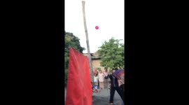Water balloon hits child during volleyball game in Indonesia