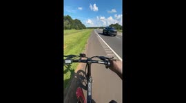 Biker falls off bicycle in Eatonton, Georgia, USA
