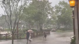 Guests run for cover at Tokyo DisneySea as Typhoon Ampil batters area