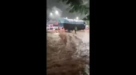Traffic policeman saves electric bike washed away in floods