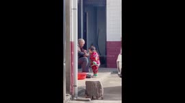 Touching moment great grandfather feeds one-year-old girl