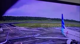 Plane cracks the runway when it lands at an airport in Indonesia