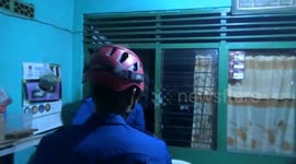 FIREFIGHTERS EVACUATE A 4.5-METER LONG PHYTON SNAKE FROM A RESIDENT'S BATH TUB