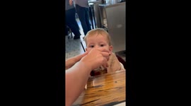 Baby bursts into smiles after first taste of Diet Coke