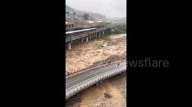 China: Powerful flood carries away freight train car
