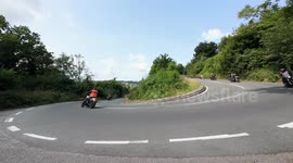 Hundreds of Harley-Davidson motorcycles head through the Cotswolds as part of the club's rally in Gloucestershire