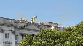 Firefighters climb Somerset House amidst plumes of smoke as a fire breaks out
