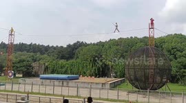 Performer falls during rope walk at Northeast Tiger Park in Changchun, China