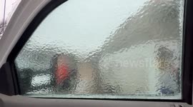 Sheet of ice shaped of the truck window breaks with so much satisfaction.