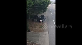Chinese pedestrian narrowly dodges out-of-control car after distracted driver crashes into roadside