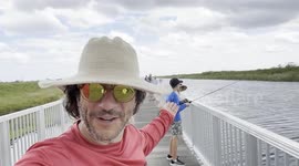 Father ecstatic after son catches large fish before cooking and eating it