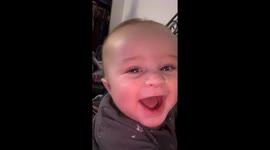 Baby laughs after seeing himself in the camera
