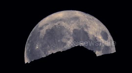 Stunning footage of blue supermoon rising and setting behind Swiss Alps