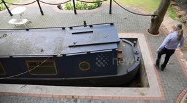 Man spends £30k building canal in garden - complete with lock and narrowboat