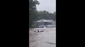 Severe flooding in Oxford, Connecticut sweeps vehicles into woods, washes away roads