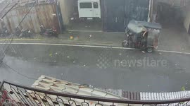 Strong winds overturn tricycle during rainstorm in Mandaluyong, Philippines