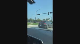 Man Rides Motorized Recliner on Sidewalk