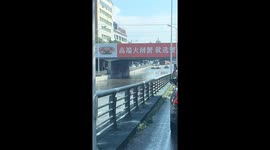 Chinese car navigate deeply flooded streets