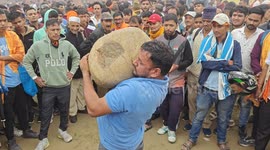 Men balance heavy stone on their necks and complete dance during this ritual in northern India