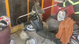 Dramatic Padang City Fire Department Evacuates a Large Monitor Lizard Entering a Resident's House