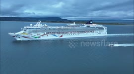 Drone Footage Of Large Cruise Ship Sailing From UK Port At Dusk