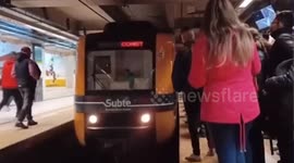Argentina: Man crosses in front of the metro in Buenos Aires