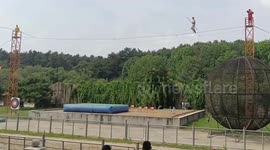 Chinese acrobat falls from tightrope and misses large safety cushion
