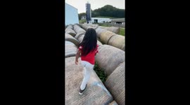 Child bounces off hay bale in Henrietta, Wisconsin