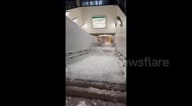 Floodwater streams into train stations across Tokyo as torrential rain hits
