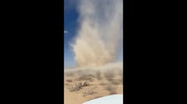 Huge dust devil swirls metres away from motorist in Texas