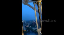 Ferris wheel door opens mid-ride, sending mother and child into panic in China