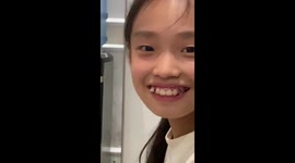 Girl's loose front tooth wobbles when she laughs
