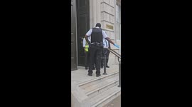 Women gets arrested for protesting outside wgitehall london resisting arrest in the process against keir starmer