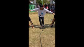Person falls immediately after tug of war begins in Bekasi, Indonesia