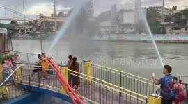 Relatives spray fire hoses for epic gender reveal