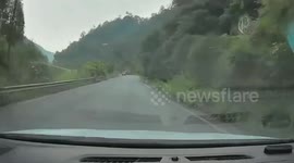 Quick-thinking driver reverses to avoid oncoming lorry crashing towards them