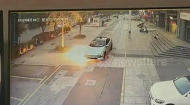 Shocking moment electric car catches fire after hitting loose brick in southern China