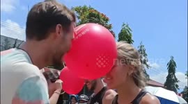 The excitement of tourists taking part in the very funny Balloon Dance Competition in Indonesia
