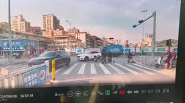 Pillion passenger topples from motorcycle at lights