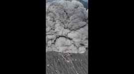 The tense moment a number of climbers ran for their lives when Mount Dukono in Indonesia erupted