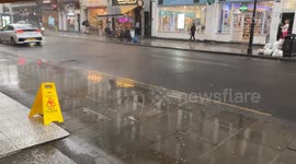 Heavy rain suddenly pours down in Central London near Gloucester Road