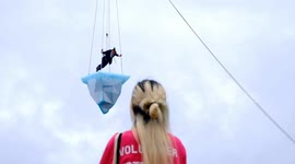 Daring performers dance on 2.5 tonne block of ice for 8 hours under the backdrop of London's Canary Wharf