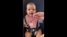 Her First Taste of Solid Food