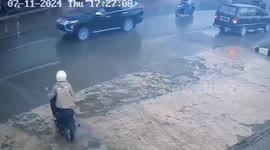 Motorcycle suddenly catches fire as rider turns onto road