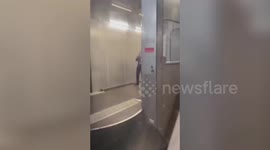 Yelling American man kicks and punches passenger plane door after missing boarding