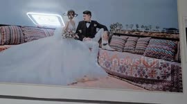 Husband ruins expensive wedding photos with black marker after losing argument to wife