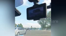 Baffled motorist films small plane being driven through traffic like any other car